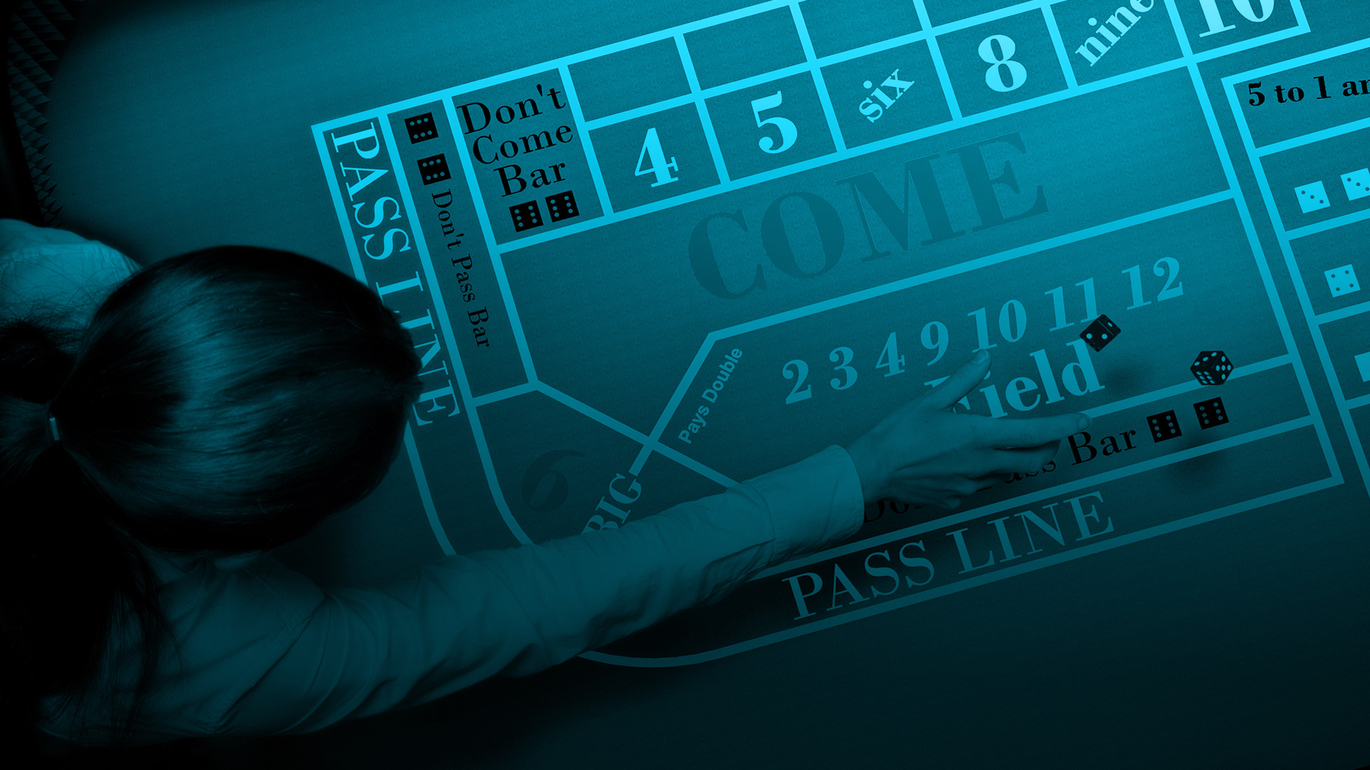 A craps table with a hand throwing dice onto the 'Come' and 'Pass Line' sections.